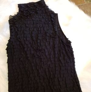Black shirt sleeve with small ruffles.